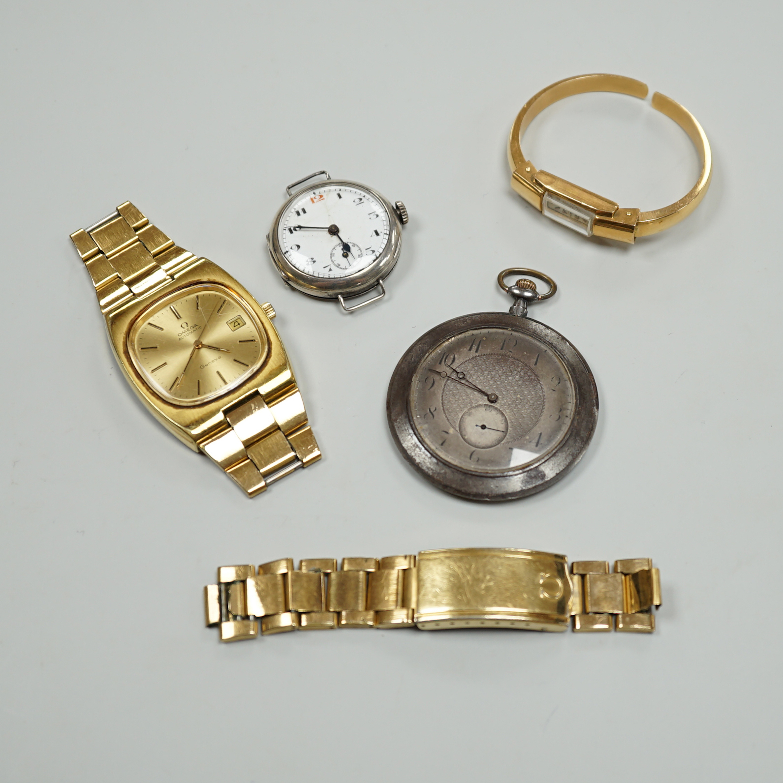 A George V silver pocket watch with arabic dial, 3.25cm, a gentleman's gold plated Omega Automatic wrist watch with loose bracelet, a gun metal dress watch and a Surena gold overlaid cocktail watch